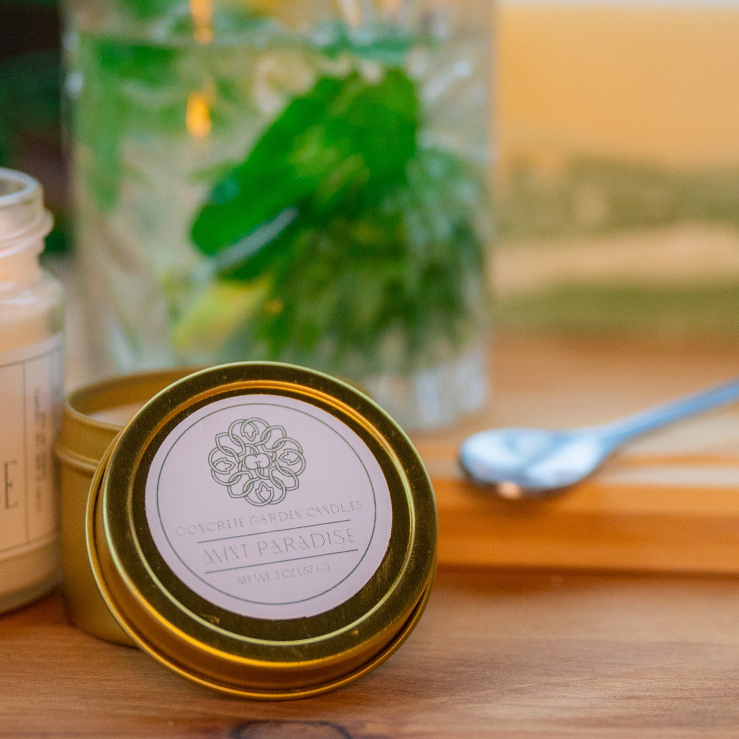 Mint Mojito with Pineapple with small soy wax scented candle and pillar scented candle with green concrete bottom on wooden table