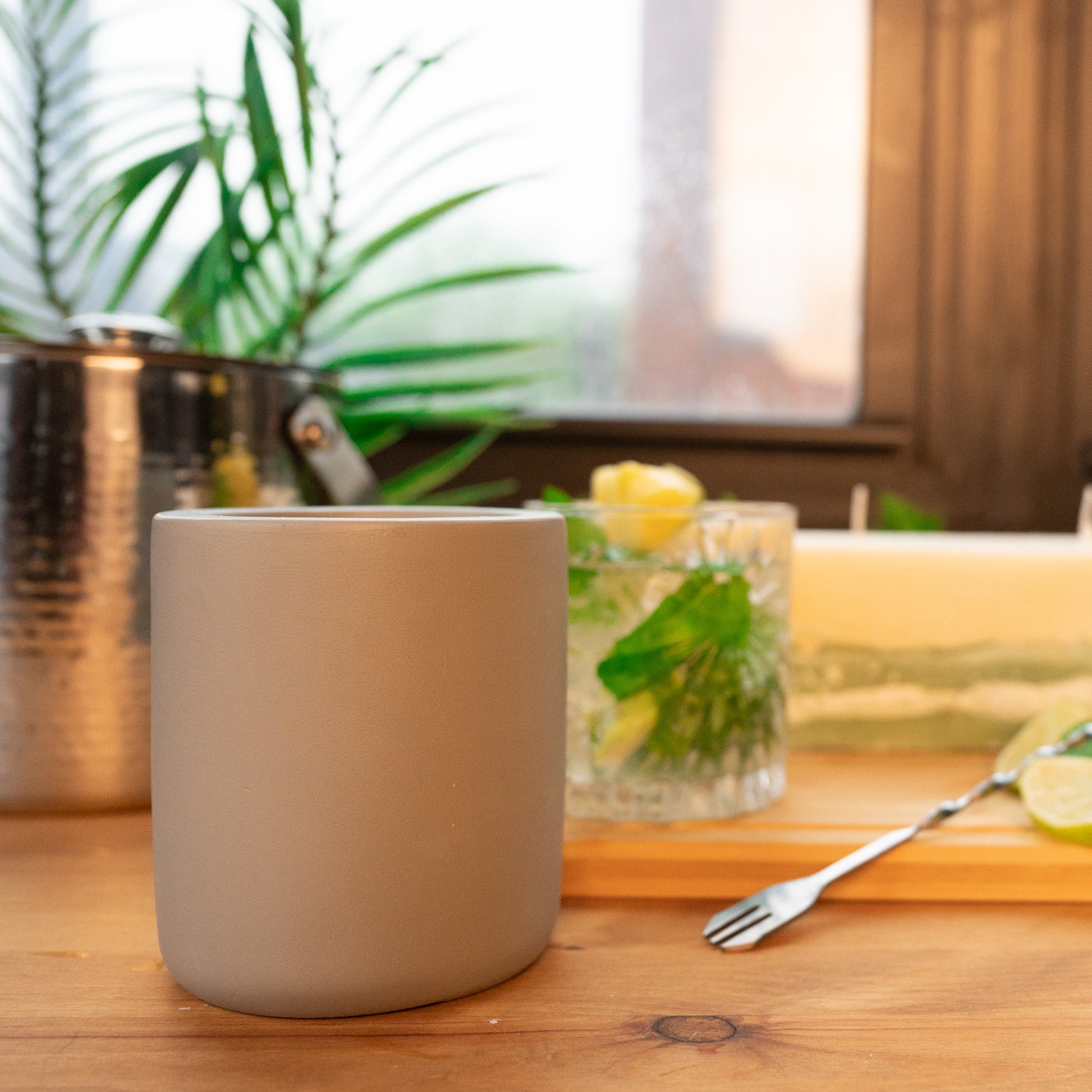 Mint Mojito with Pineapple and Lime with soy wax scented large concrete candle and pillar scented candle with green concrete bottom on wooden table